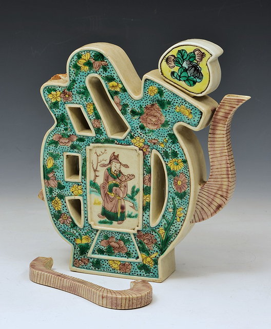 Appraisal: A CHINESE FAMILLE VERTE GLAZED BISCUIT WARE TEA WINE POT