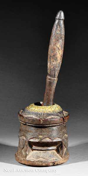 Appraisal: A Bedouin Brass-Mounted Carved Wood Coffee Bean Grinder Mihbaj Syria