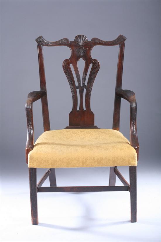 Appraisal: GEORGIAN STYLE CARVED MAHOGANY ARM CHAIR early th century Shell