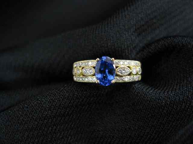 Appraisal: Tanzanite Diamond Ring carat rich oval gem with diamonds on