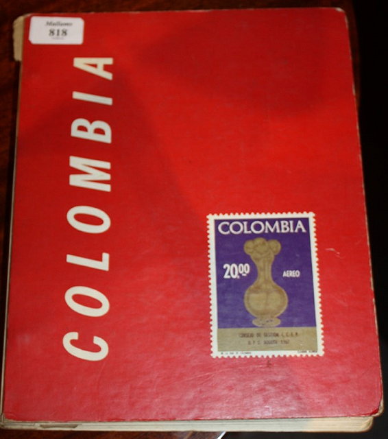 Appraisal: STAMPS A printed hardback album containing assorted Columbian stamps mainly