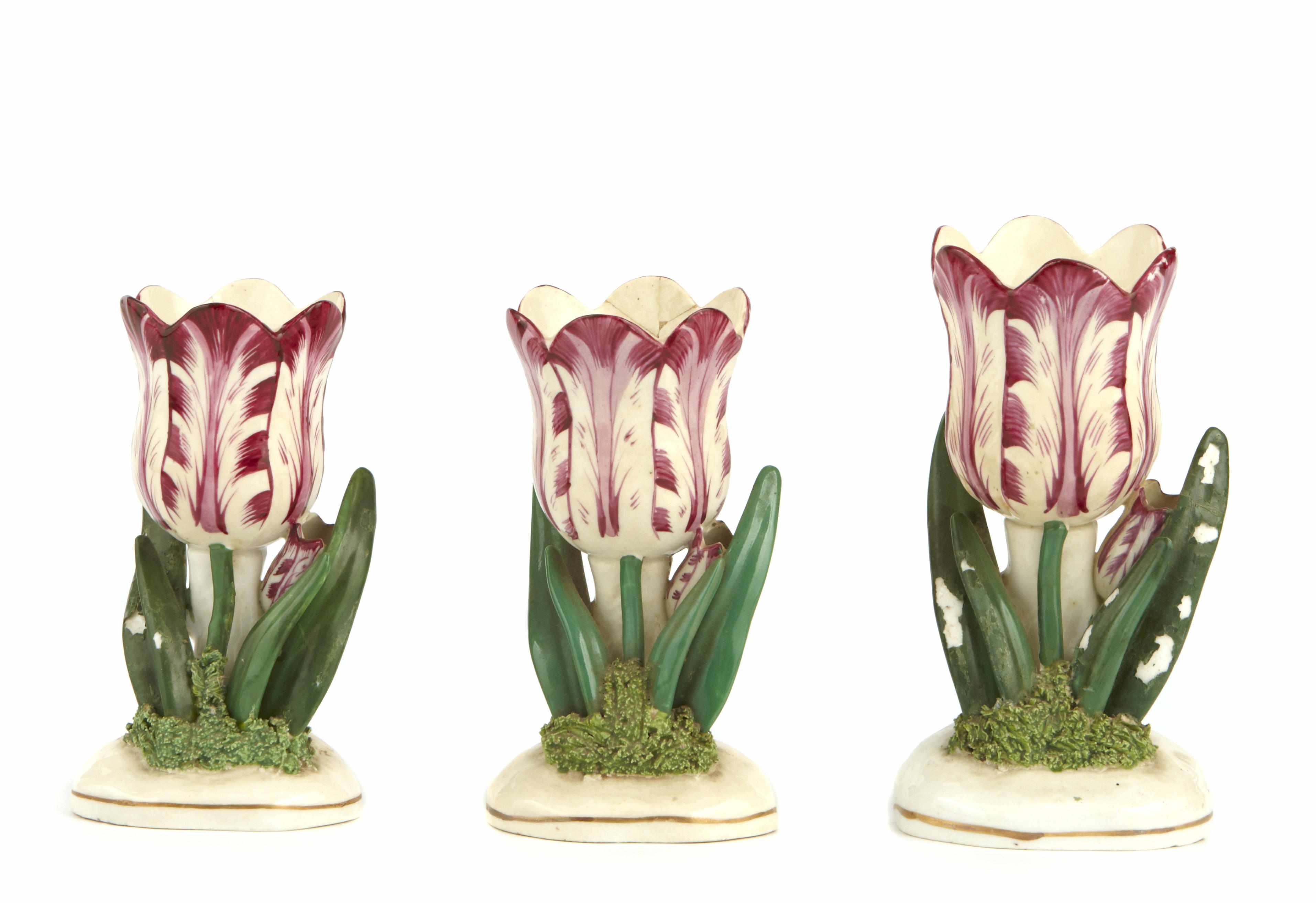 Appraisal: A group of three English creamware tulip form vases height