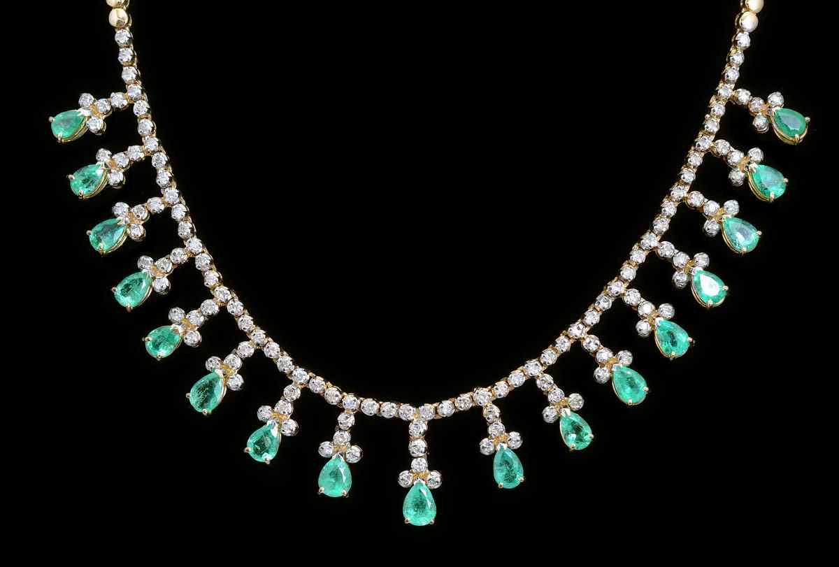 Appraisal: EMERALD DIAMOND NECKLACE pear shaped emeralds dangle from a K