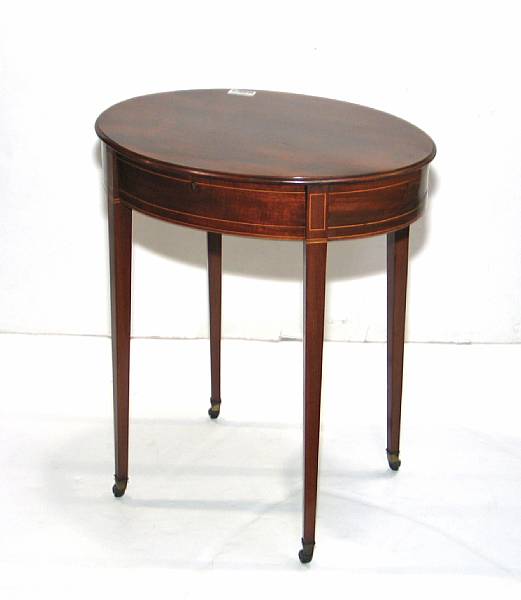 Appraisal: A Regency style inlaid mahogany oval table mid th century