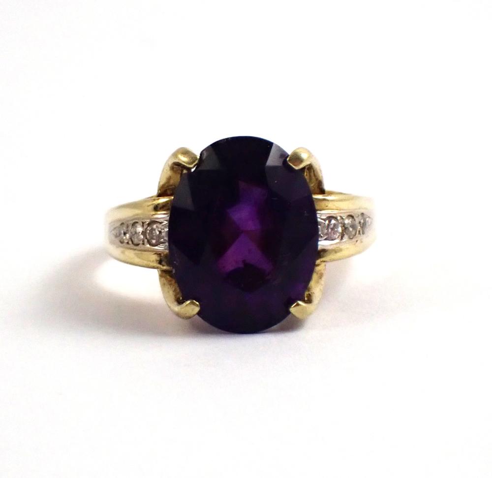 Appraisal: AMETHYST DIAMOND AND FOURTEEN KARAT GOLD RING with three round-cut