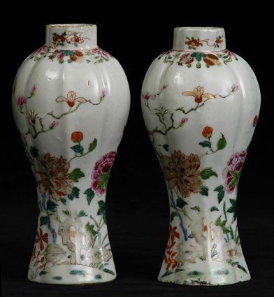 Appraisal: PAIR OF CHINESE FAMILLE ROSE BALUSTER-FORM MANTEL VASES Each fluted