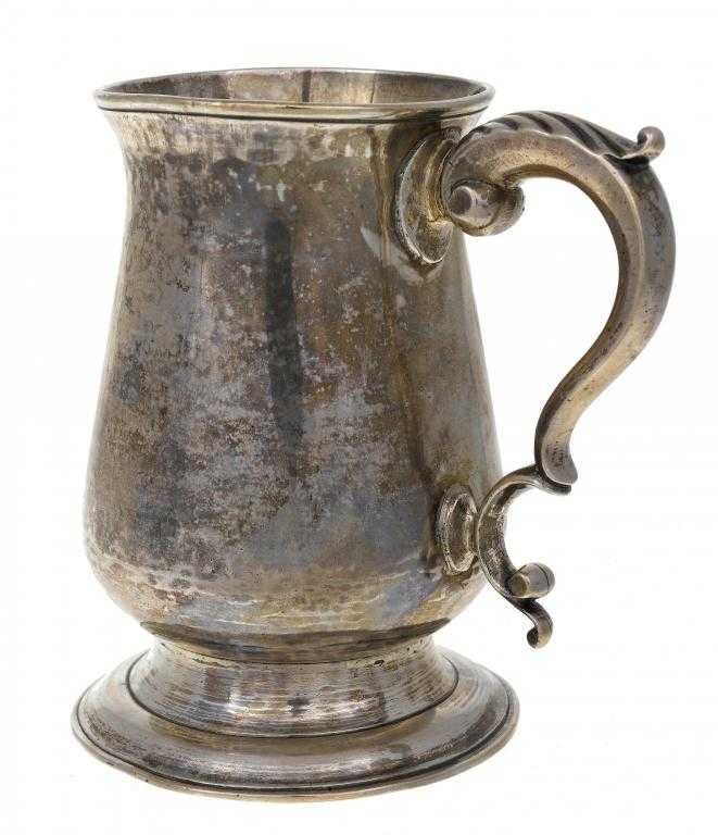 Appraisal: A GEORGE III MUG of baluster shape with leaf capped