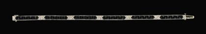 Appraisal: karat white gold black onyx and diamond flexible bracelet French