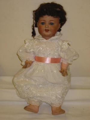 Appraisal: An Armand Marseille bisque head girl doll with blue glass