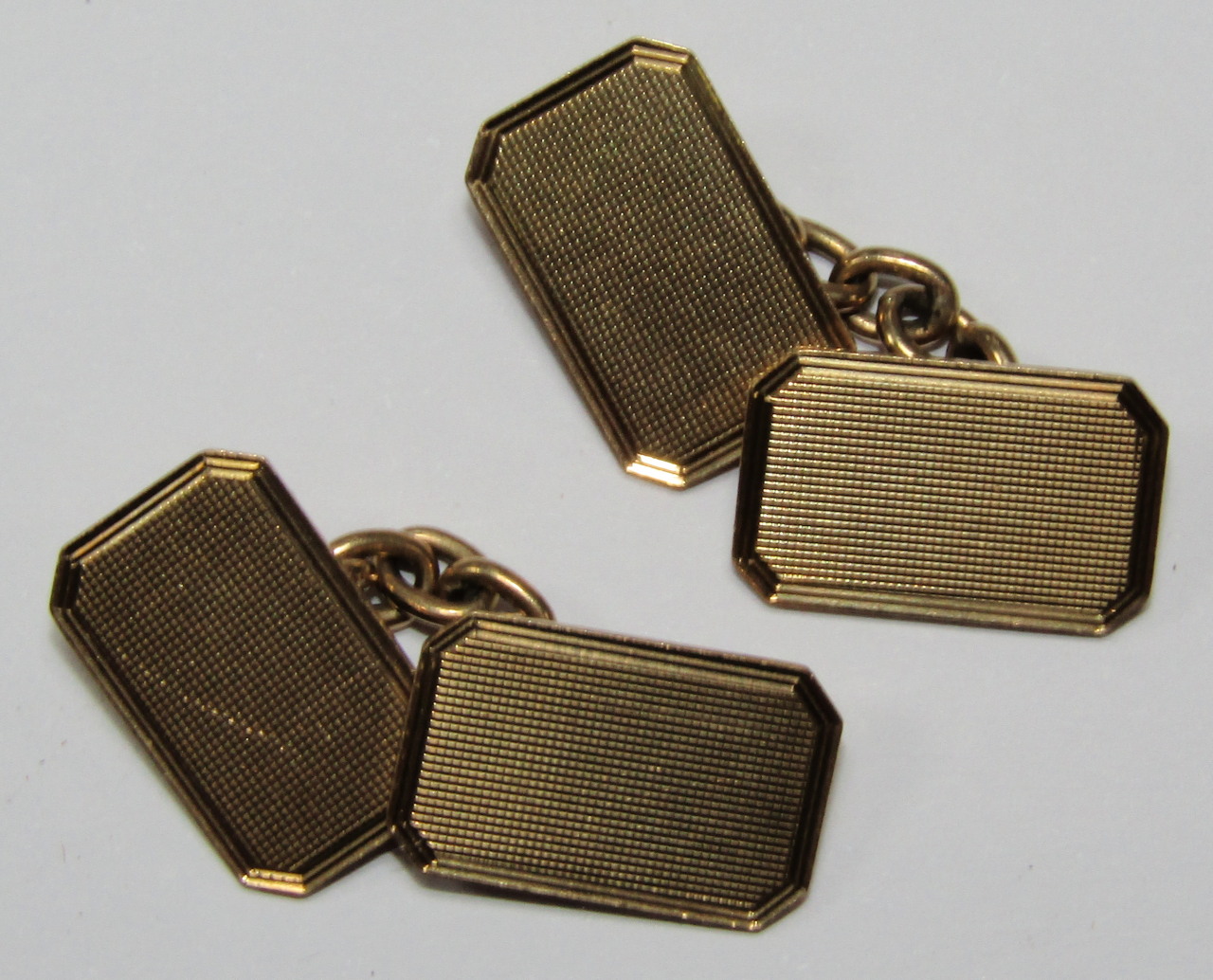 Appraisal: A pair of ct gold cufflinks each with engine turned