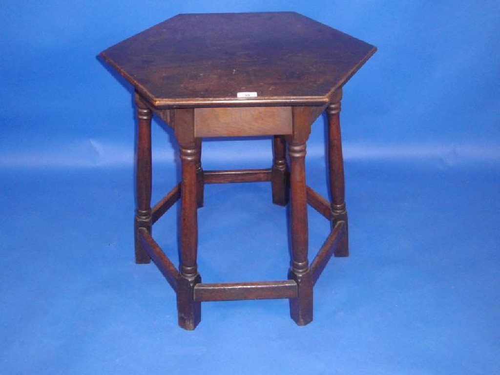 Appraisal: A Georgian oak occasional table with hexagonal moulded top and