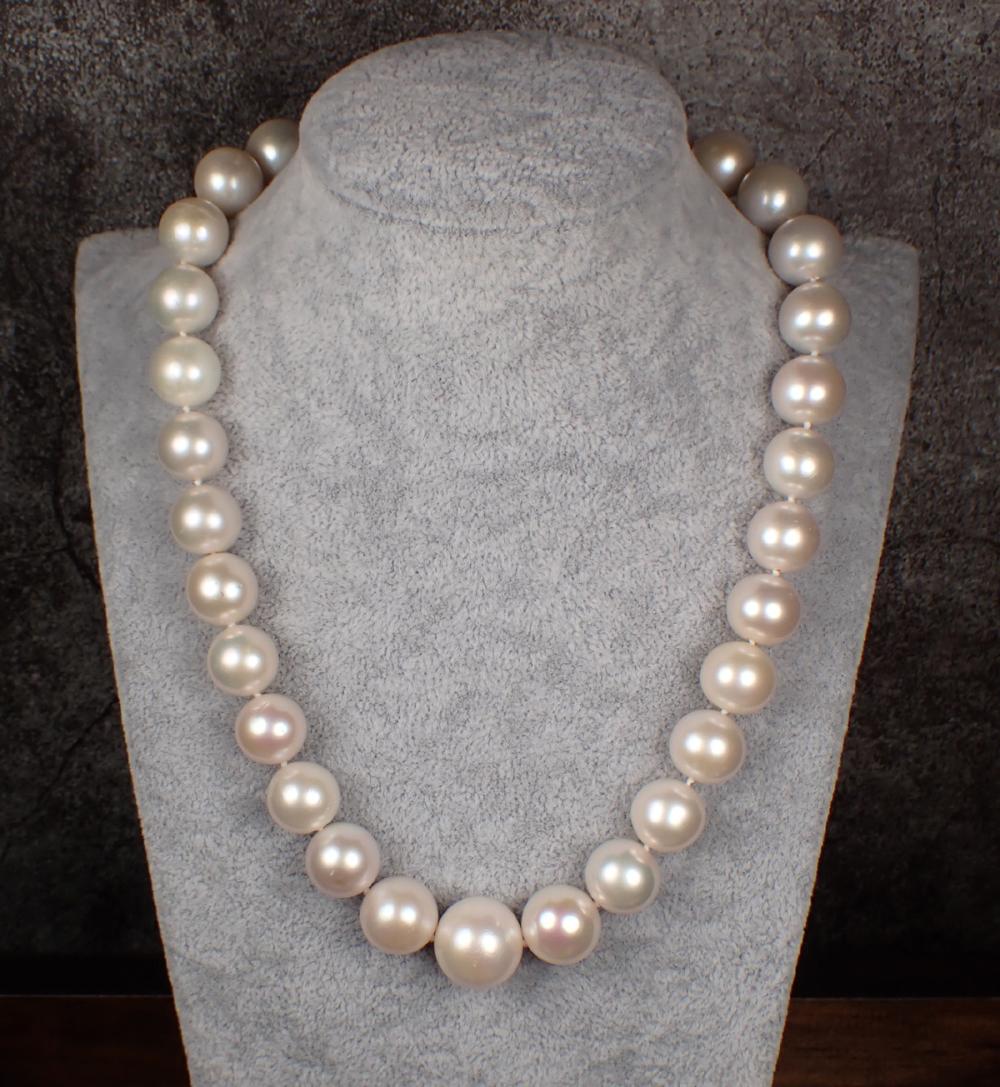 Appraisal: SOUTH SEA PEARL DIAMOND AND EMERALD NECKLACE The - hand-knotted