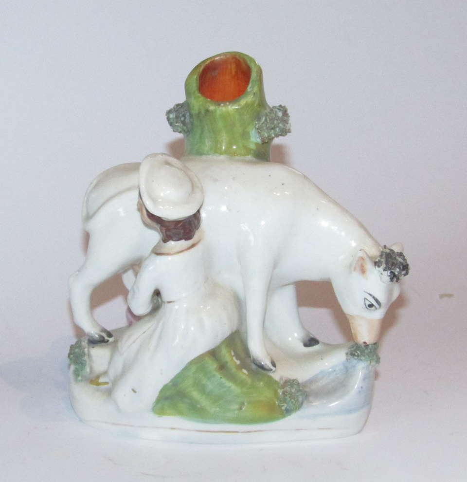 Appraisal: A mid- thC Staffordshire milkmaid and cow spill vase group