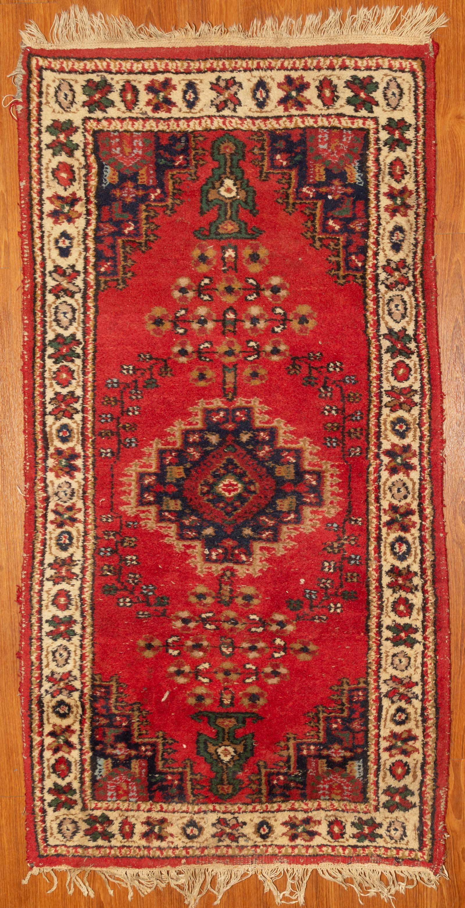 Appraisal: TRIBAL DESIGN RUG INDIA X Fourth quarter- th century hand-knotted