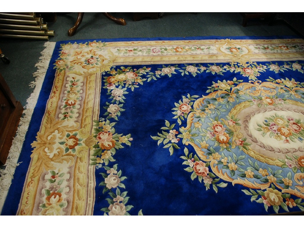 Appraisal: WASHED CHINESE CARPET in similar taste with Royal blue field