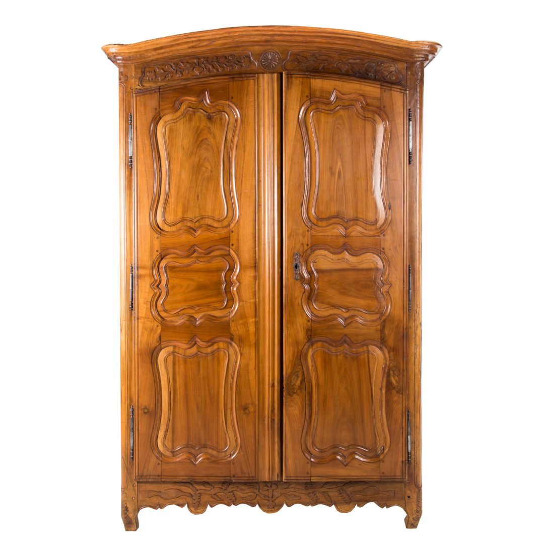 Appraisal: French Provincial walnut armoire late th arched molded top foliate