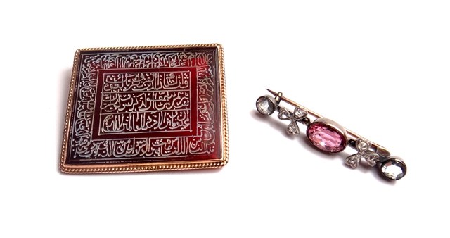 Appraisal: A gold mounted rectangular cornelian brooch decorated with Islamic script