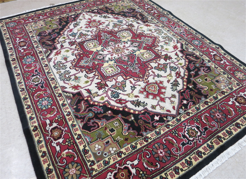 Appraisal: HAND KNOTTED ORIENTAL CARPET Indo-Heriz ' x '