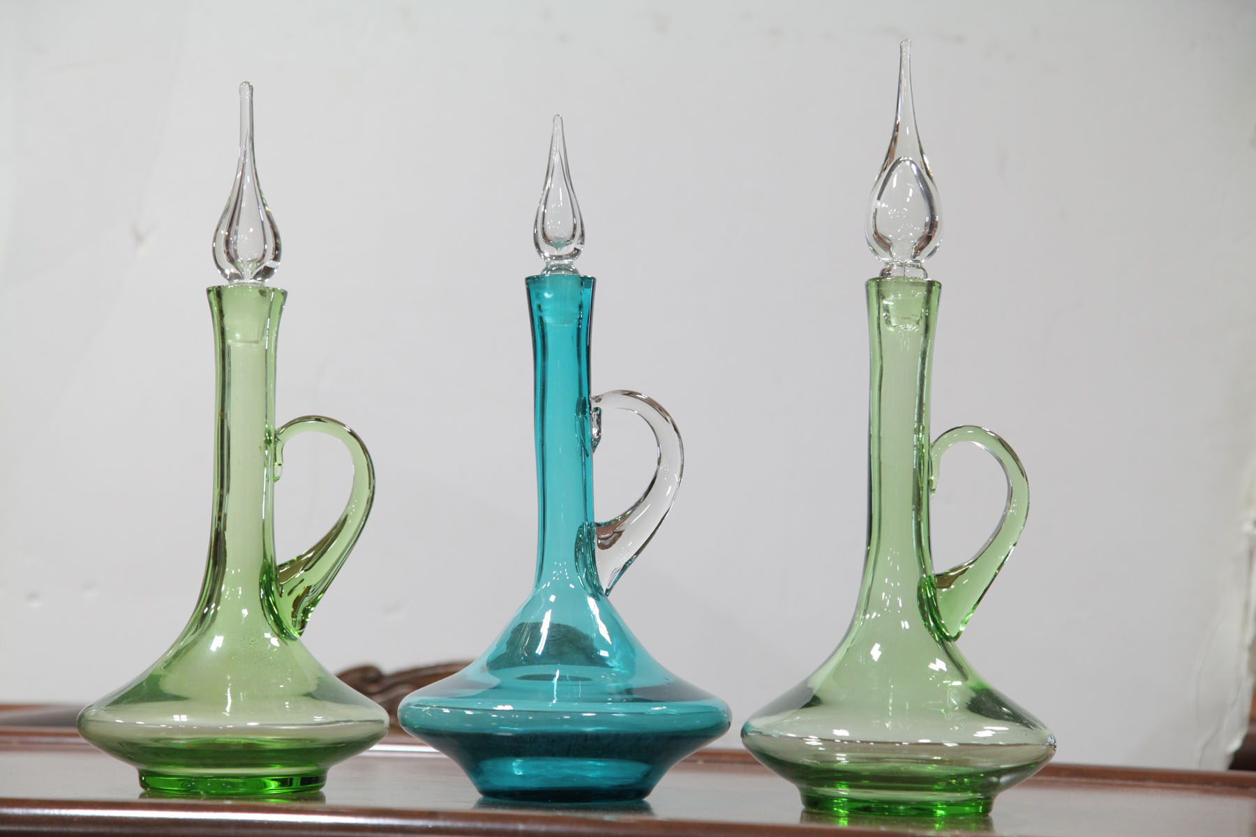 Appraisal: THREE BISCHOFF GLASS DECANTERS West Virginia third quarter th century