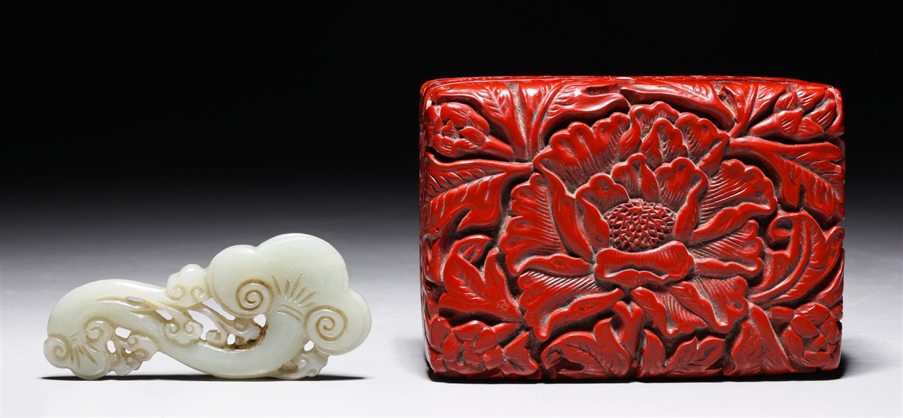 Appraisal: Chinese carved celadon jade toggle lingzhi form in red lacquer-like