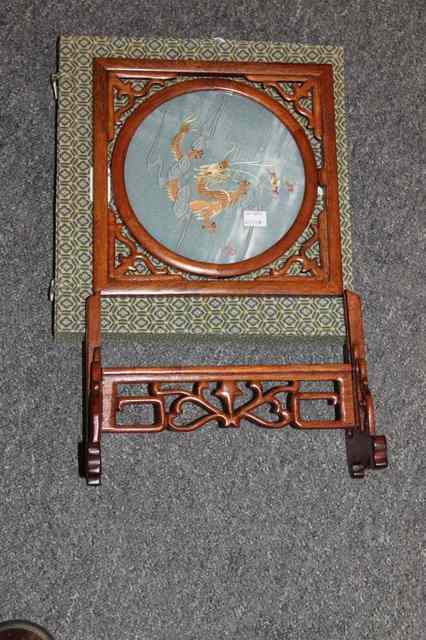 Appraisal: A MODERN CHINESE SCREEN in mahogany with central glass panel