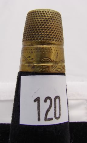 Appraisal: Gold tone thimble with leaf scroll band