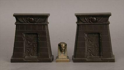 Appraisal: Pair of Egyptian Revival Patinated Metal Bookends Together with a