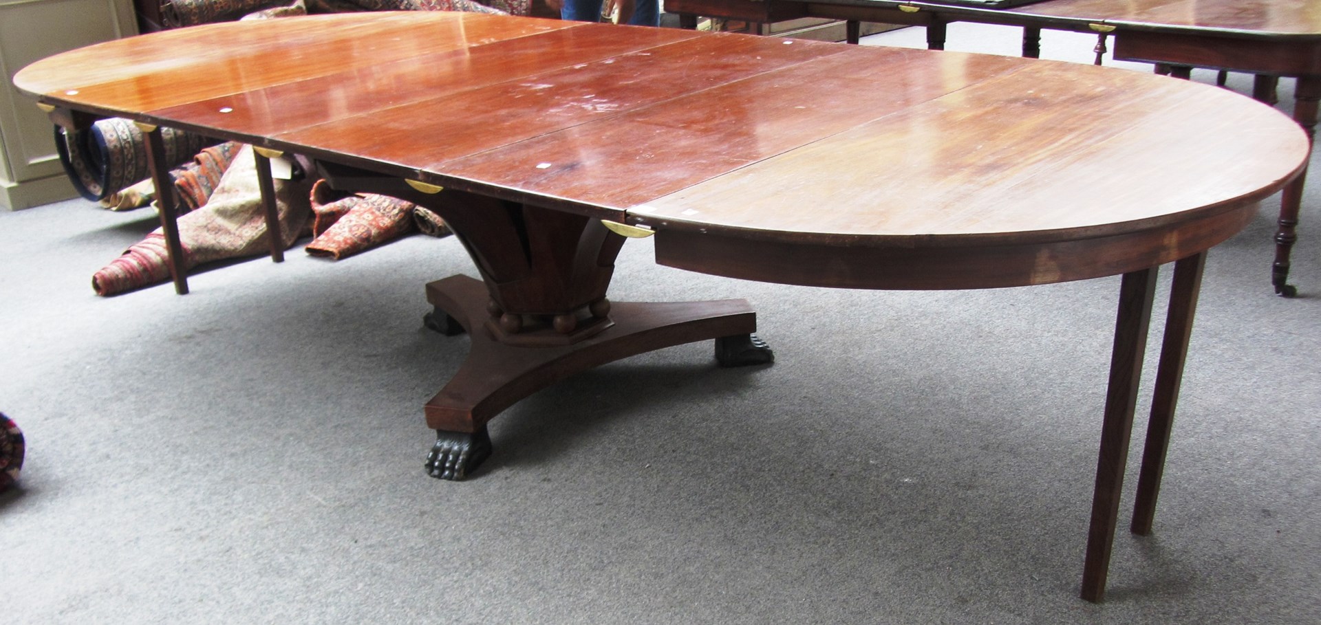 Appraisal: A th century circular mahogany extending dining table on a