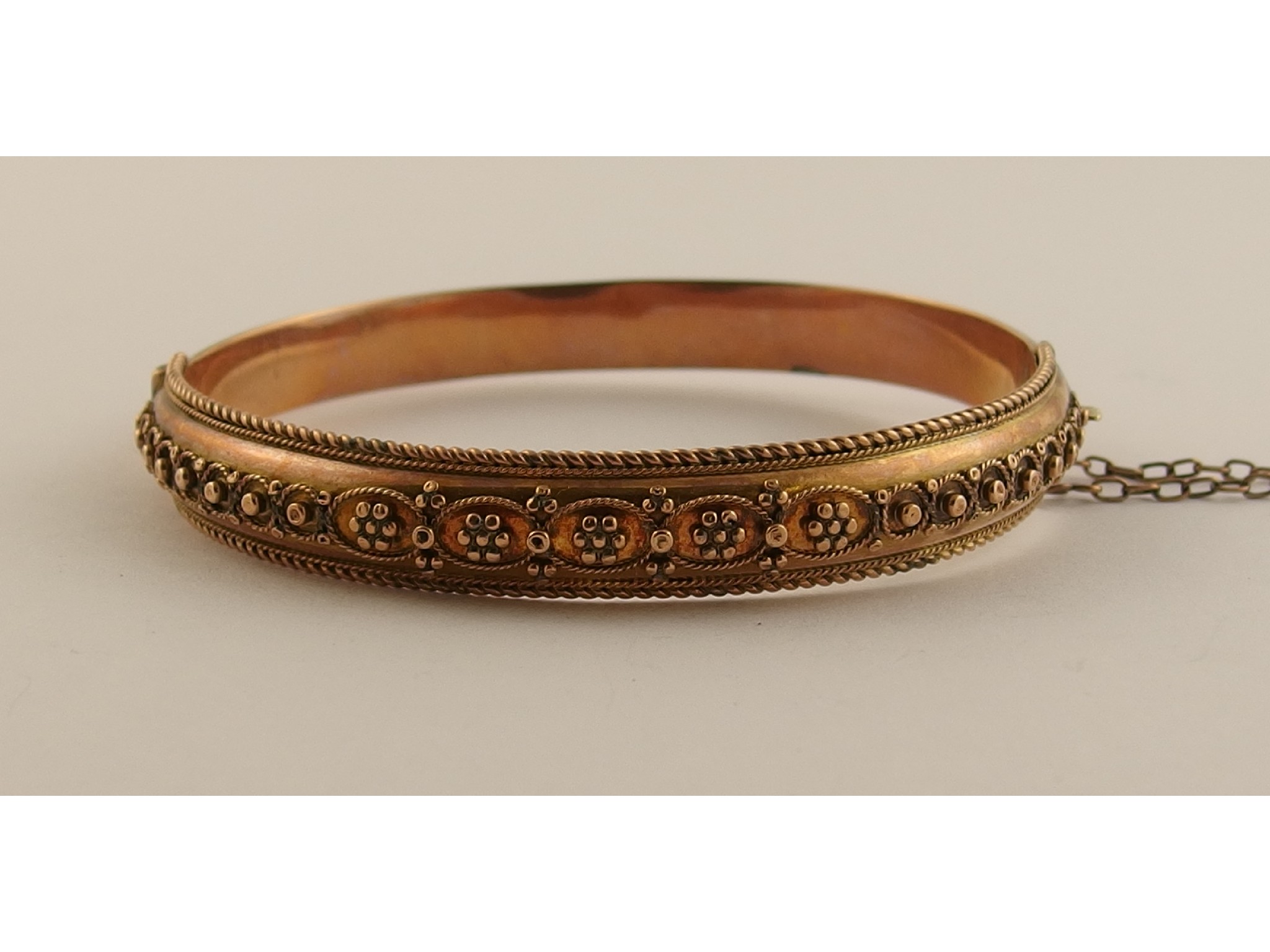 Appraisal: A ct rose gold Etruscan revival design bangle gms