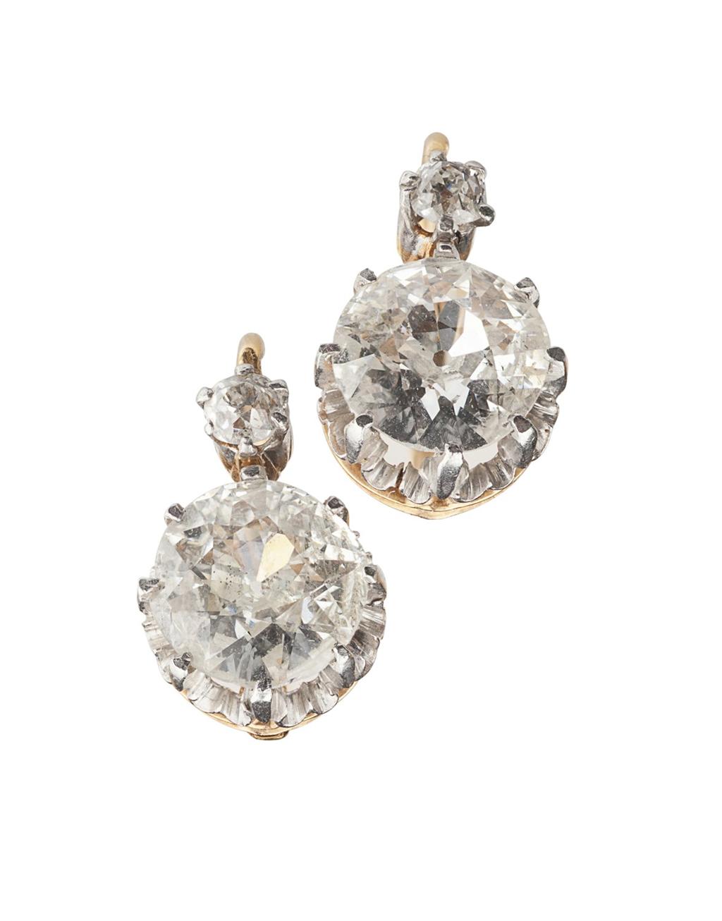 Appraisal: A pair of French gold mounted diamond set pendant earrings