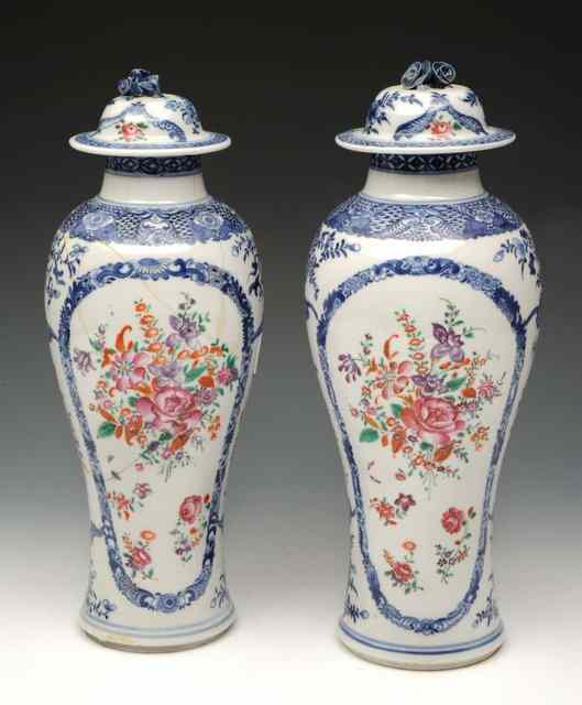 Appraisal: A PAIR OF CHINESE BALUSTER VASES and covers decorated in