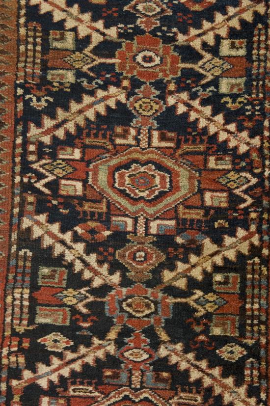 Appraisal: Persian runner th century Geometric patterns on blue ground with