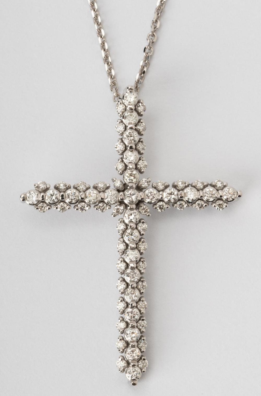 Appraisal: KARAT WHITE GOLD DIAMOND CROSS NECKLACEContaining full-cut diamonds H-J VS-SI