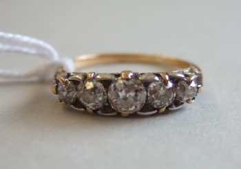 Appraisal: A gold and diamond set five stone ring mounted with