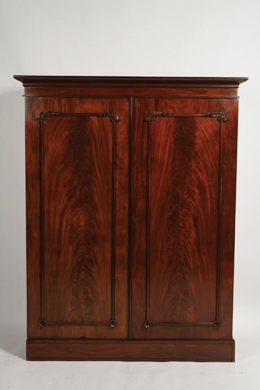 Appraisal: AN EARLY VICTORIAN MAHOGANY WARDROBE with a moulded top above