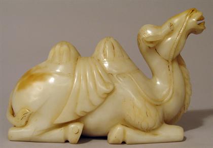 Appraisal: Chinese large white jadeite model of a camel Seated on