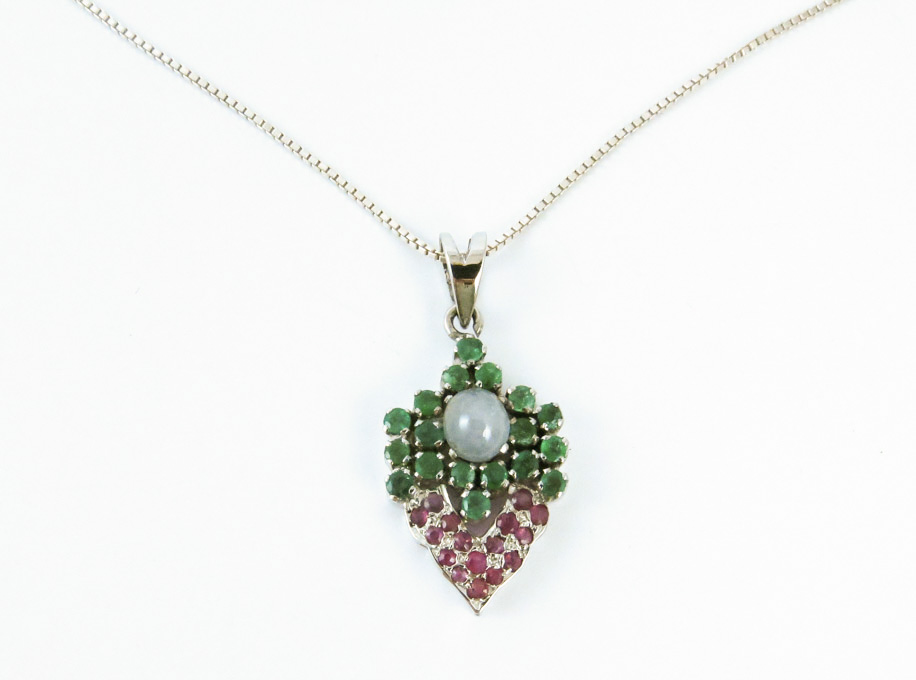 Appraisal: STAR SAPPHIRE RUBY AND EMERALD PENDANT NECKLACE suspended on a