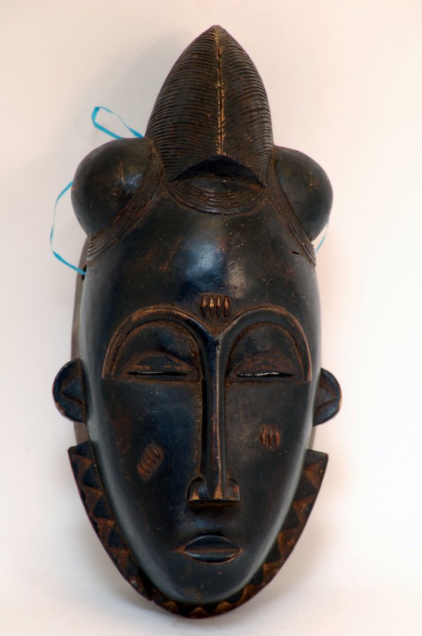 Appraisal: Diminutive Baule carved face mask black patinated wood with typical