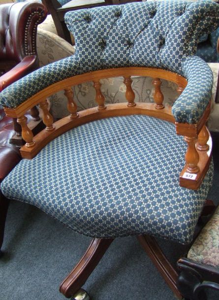 Appraisal: A th century beech framed tub back office swivel chair