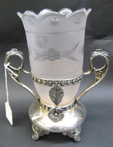 Appraisal: AN AMERICAN VICTORIAN SPOONER the quadruple silver plated original footed