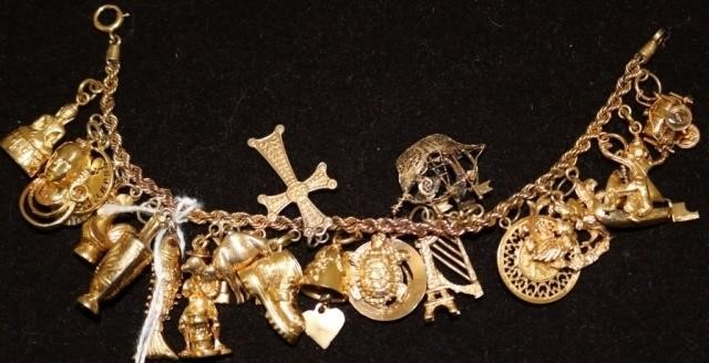 Appraisal: KT GOLD CHARM BRACELET WITH CHARMS OF KTAND KT GOLD