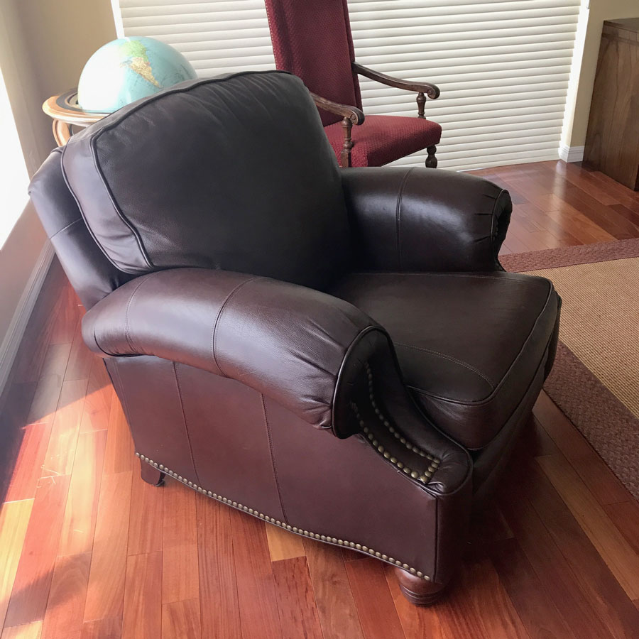 Appraisal: BROWN TACKED LEATHER RECLINER Thick padded brown leather upholstery with