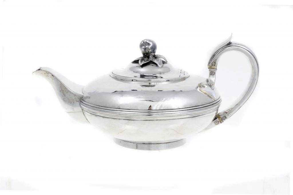 Appraisal: A WILLIAM IV TEAPOT compressed circular with reeded girdle the