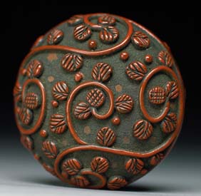 Appraisal: ANTIQUE LACQUER MANJU Antique cinnabar lacquer two-part manju elaborately decorated