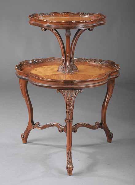 Appraisal: An Edwardian Carved Mahogany and Inlaid Dumbwaiter c the two-tiered