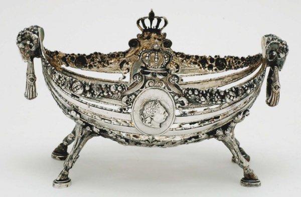 Appraisal: A pierced basket form resting on hooved feet and surmounted