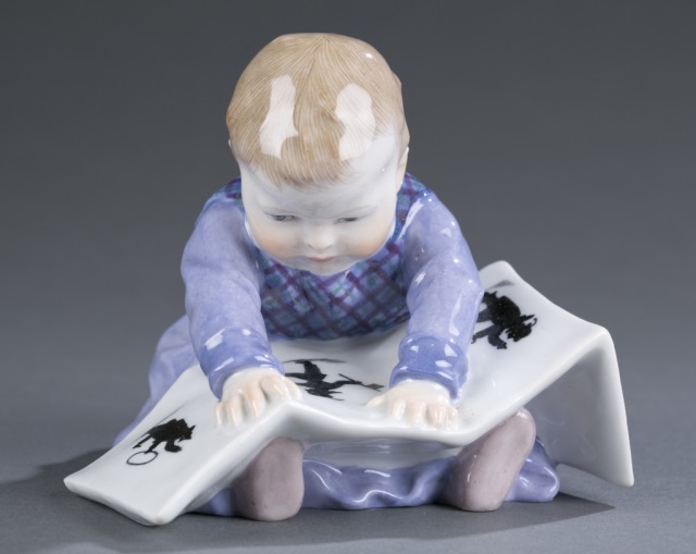 Appraisal: Meissen Porcelain Figure Konrad Hentschel Boy sitting with book Crossed