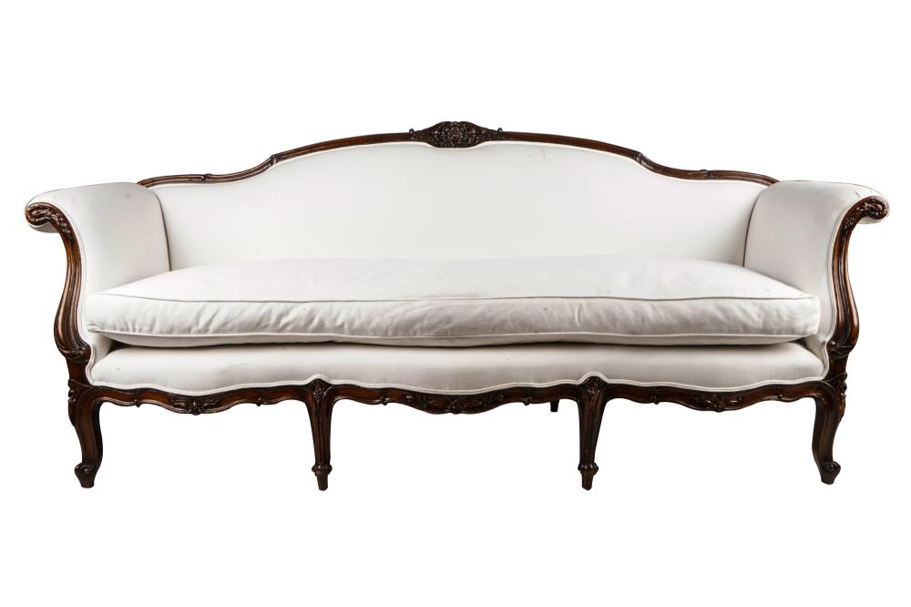 Appraisal: LOUIS XV PROVINCIAL STYLE CARVED WALNUT SETTEEupholstered in white canvas