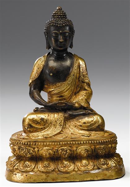 Appraisal: Sino-Tibetan partially gilt bronze figure of Sakyamuni th century Two