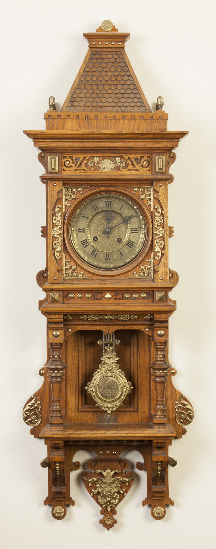 Appraisal: German Wall Clock Oak case old refinish applied brass decoration